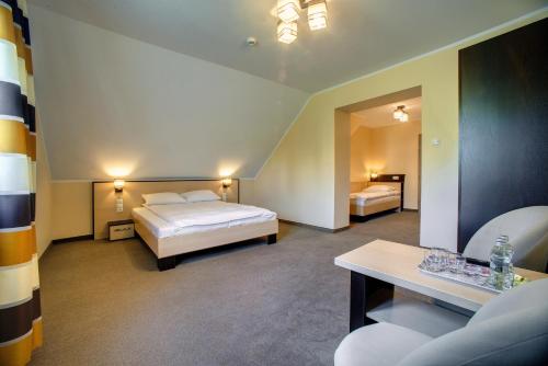 Кровать или кровати в номере Zajazd Sanocki