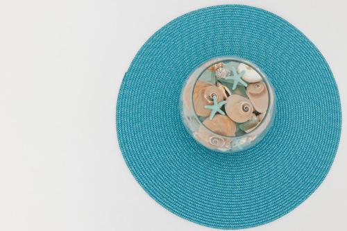 a blue hat with a decoration on top of it at La barca apartments in Becici