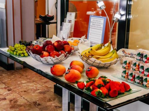 a display of fruits and vegetables on a table at Hotel Luxia in Paris