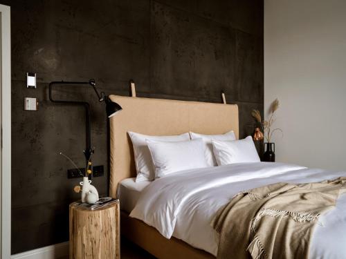 a bedroom with a large bed with white pillows at 1884 Norderney in Norderney