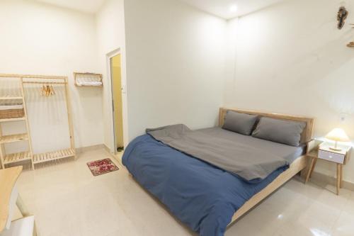 a bedroom with a large bed in a room at Cloud River Homestay in Da Lat