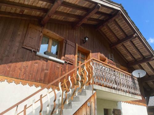 a wooden building with a balcony and a window at Chalet Chez Gaby 2 in Morzine