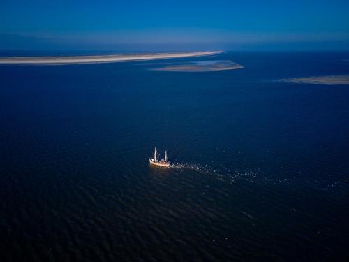 a boat in the middle of a large body of water at 1884 Norderney in Norderney