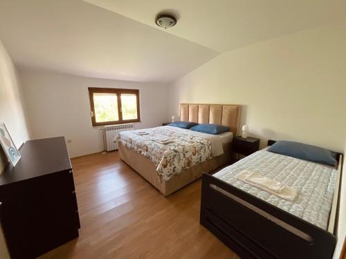 Llit o llits en una habitació de Apartment Camellia 2