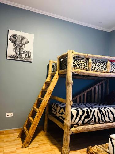 Ένα ή περισσότερα κρεβάτια σε δωμάτιο στο Safari villa