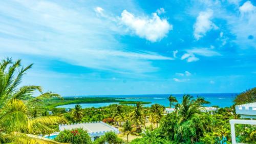 a view of the ocean from a resort at Castles In Paradise Villa Resort in Vieux Fort