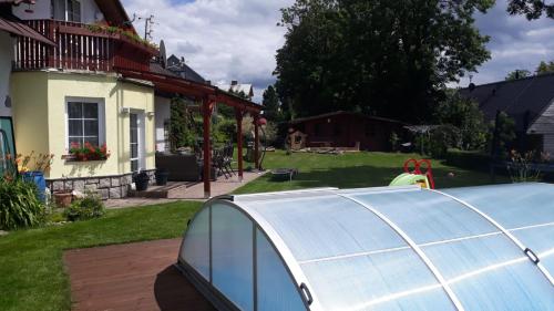 a solar panel in the yard of a house at Penzion Irena in Strážné