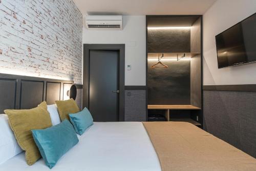 Letto o letti in una camera di BYPILLOW San Mamés