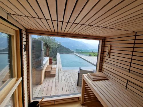 a view of a pool from the inside of a house at Bella Flocon appartements min 2 Nights Special weekly and monthly prices in Savièse