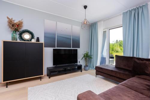 TV a/nebo společenská místnost v ubytování Künka Kodu - Cozy two bedroom apartment with sauna