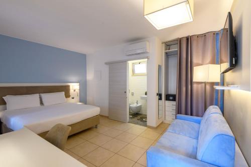 Postel nebo postele na pokoji v ubytování Hotel & Apartments Sasso