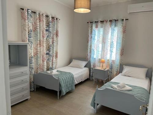 Postel nebo postele na pokoji v ubytování Nano's House Οροφοδιαμέρισμα στο κέντρο