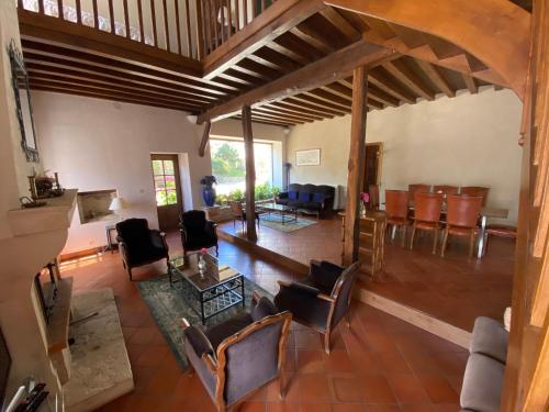 an overhead view of a living room with chairs and tables at Domaine Les Hauts Prés in Villaines-les-Prévôtes