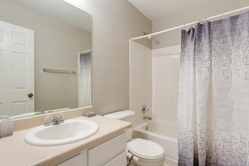 a bathroom with a sink and a toilet and a shower at Spacious Aurora Home 20 Mi to Downtown Denver! in Aurora