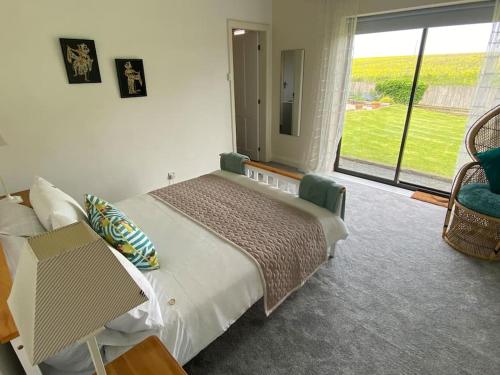 a bedroom with a bed and a large window at The Fold - 5 mins to Lytham St Annes - Ribby Hall Village 