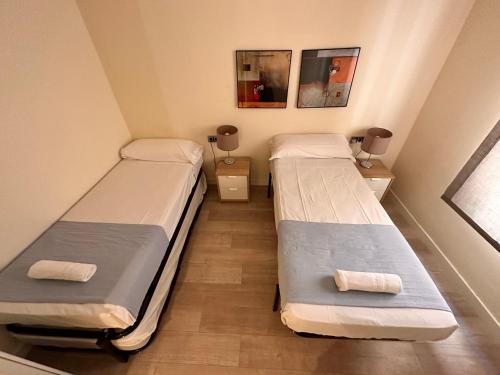 Een bed of bedden in een kamer bij Gracia Barcelona Apartment