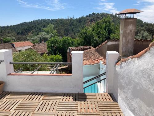a balcony with a view of a house at La Casita in Fuente del Oro