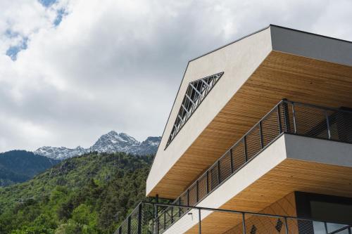 a building with a view of the mountains at Schloss Plars wine & suites in Lagundo