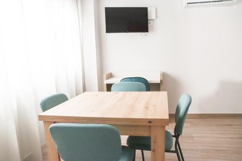 a conference room with a wooden table and chairs at HOTEL NARCEA in Santa Pola