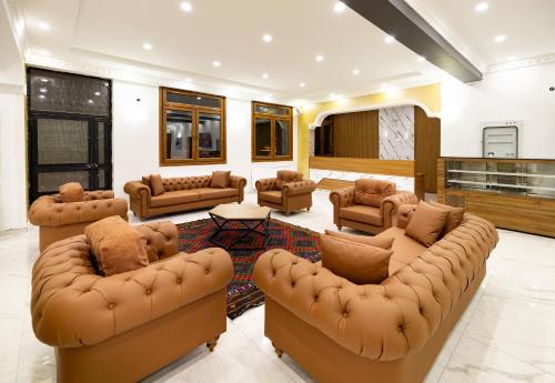a large living room with couches and a table at Avulot Mountain Resort Hotel in Trabzon