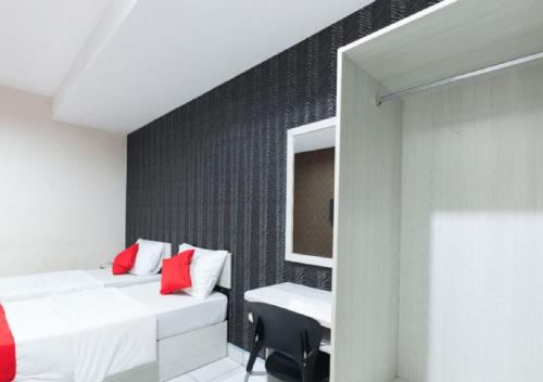 Ένα ή περισσότερα κρεβάτια σε δωμάτιο στο Hotel Pulai Ipoh
