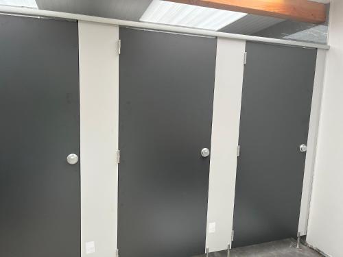 a row of glass doors in a room at Ferry House Holidays in New Ross