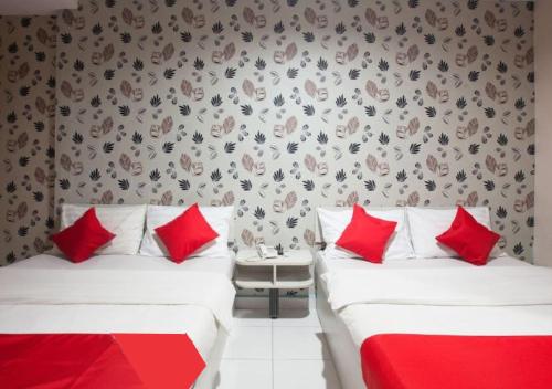 Ένα ή περισσότερα κρεβάτια σε δωμάτιο στο Hotel Pulai Ipoh