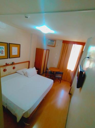 Postel nebo postele na pokoji v ubytování César Inn Juiz de Fora Hotel