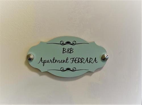 a sign on a wall that says big adjustment centreila at Bnb apartment Ferrara in Udine