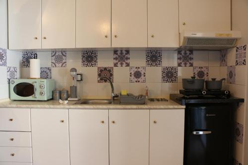 Kuchyň nebo kuchyňský kout v ubytování Olive Apartment
