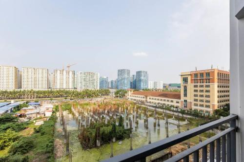 a view from a balcony of a city with buildings at Cozy Staycation Shore 2 Residences Tower 2 in Manila