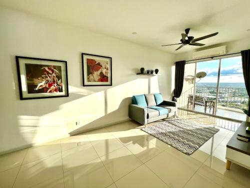 a living room with a couch and a ceiling fan at Home Away From Home In Taiping - Newly Upgraded! in Taiping