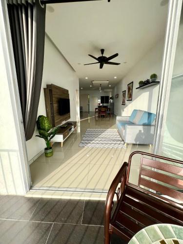 a living room with a ceiling fan and a couch at Home Away From Home In Taiping - Newly Upgraded! in Taiping