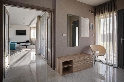 a bathroom with a wooden vanity and a mirror at Penzion Solid Spa in Mladá Boleslav