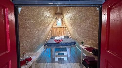a small room with a bed inside of a tent at Malé Milé Áčko in Nižné Malatíny
