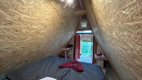 a view of a room with a bed in a tiny house at Malé Milé Áčko in Nižné Malatíny