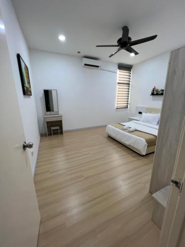 a bedroom with a bed and a ceiling fan at Home Away From Home In Taiping - Newly Upgraded! in Taiping