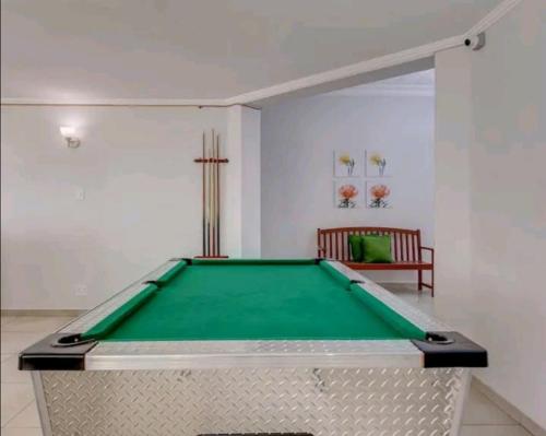 a pool table in a living room with at East Prestige lodge in Johannesburg