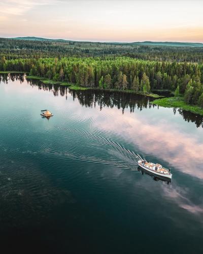 an aerial view of a boat on a lake at Tentipi River Camp in Sorsele