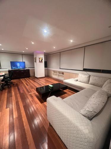 a living room with a couch and a table at Cosway Residence near Pavilion KL in Kuala Lumpur