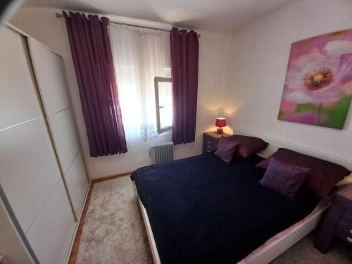 Una cama o camas en una habitación de Goran Apartmani