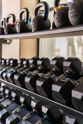 a row of black and white cups on shelves at Ikies of Mykonos in Mýkonos City
