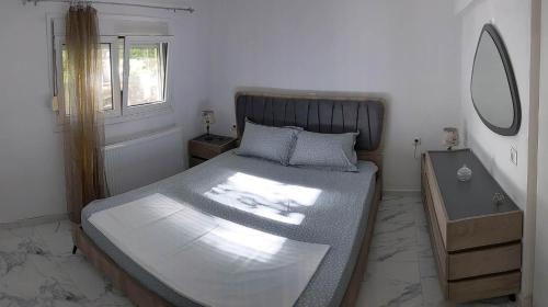 Postel nebo postele na pokoji v ubytování Anchorage Apartment in Rachoni