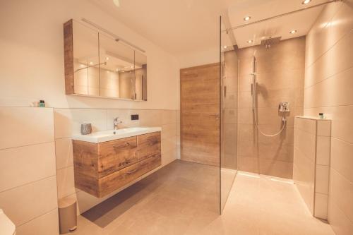 a bathroom with a sink and a shower at Apartment Gipfelblick in Kirchdorf in Tirol