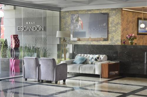 a living room with a couch and two chairs at KALI Escandón Mexico City in Mexico City