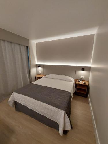 Katil atau katil-katil dalam bilik di Mogano Business Hotel- ELETROPOSTO