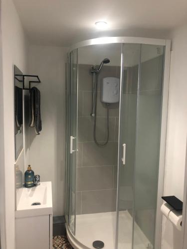 a bathroom with a shower with a glass shower stall at Modern En-suite Double Room in Newport