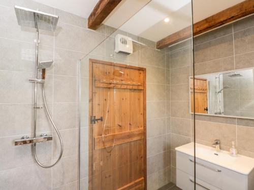 a bathroom with a shower and a sink at Little Barn in Chippenham