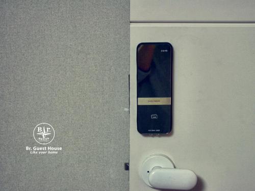 a cell phone is inserted into a machine at Br. Guesthouse Hongdae in Seoul