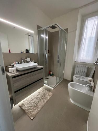 a bathroom with a shower and a sink and a toilet at Casa Laura in Pieve a Nievole